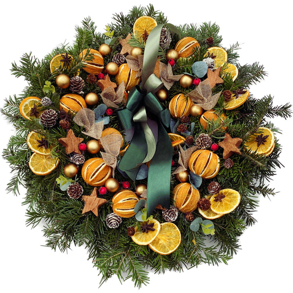 Natural fir wreath with oranges and stars
