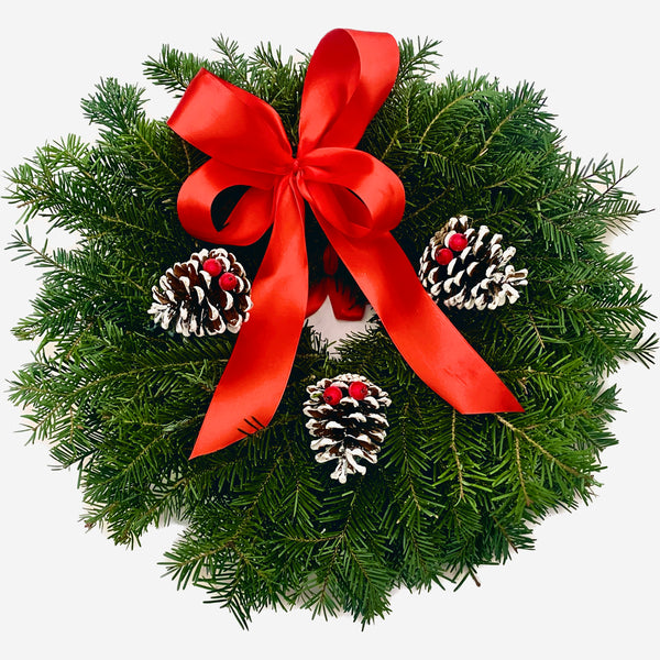 Christmas wreath with bow and cones